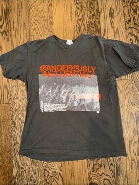 Graphic Tee - Black and Orange Print. “dangerously influential” ~